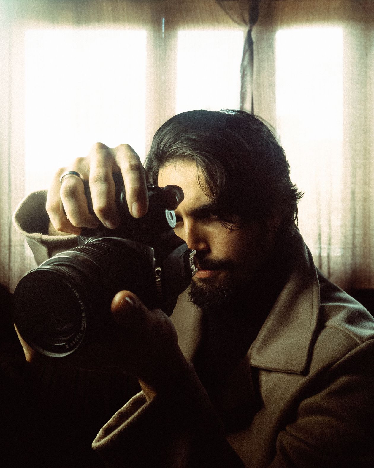 Photographer with camera in dramatic light
